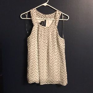 White shirt, black polka dots.